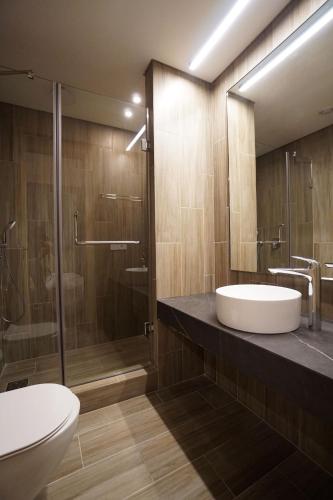 a bathroom with a sink and a shower at VOTRE hotel in Jounieh
