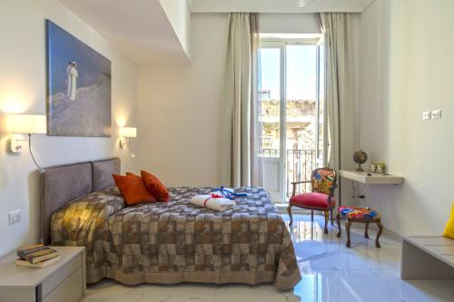 מיטה או מיטות בחדר ב-Corinzia Casa Vacanze