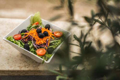 a salad in a bowl on a table at Ponte Porton Dining & lodging in Grožnjan