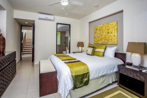 a bedroom with a large bed and a staircase at Marival Distinct All-Suites & World Spa - Handwritten Collection in Nuevo Vallarta 