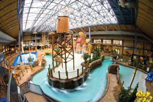 a large indoor swimming pool in a building at Penthouse Mountain Haven with Community Spa Room in Kellogg