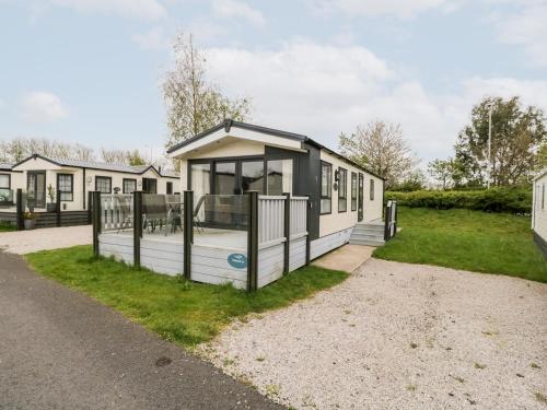a tiny house on the side of a road at Number 10 in Carnforth