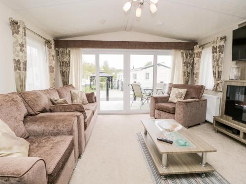 a living room with a couch and a table at Number 10 in Carnforth
