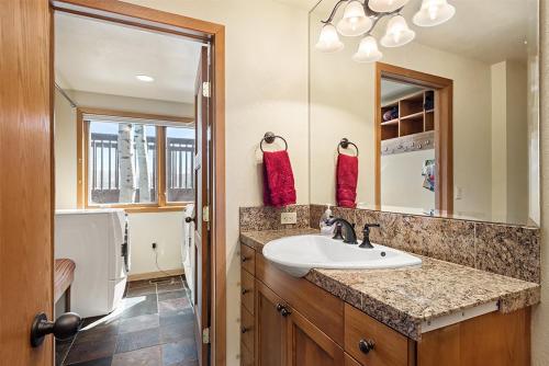 a bathroom with a sink and a mirror at 229 Faraway The Ridge #35 condo in Snowmass Village