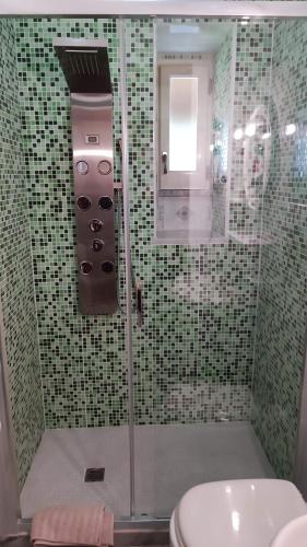 a bathroom with a shower with a toilet and a sink at Residence Villa Cristina in Ischia
