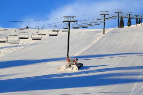 a ski lift on a snow covered ski slope at Schussing Escape in Truckee