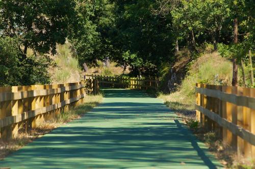 a long road with a fence on the side at Casa das Eiras in Tondela