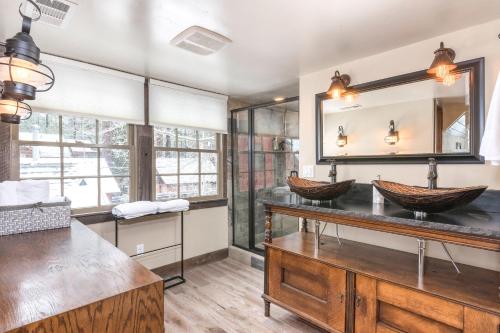 a bathroom with two sinks and a mirror at Lakeview Manor in South Lake Tahoe