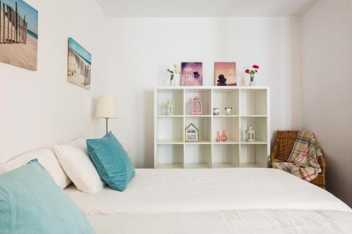 Postel nebo postele na pokoji v ubytování Apartamentos Cornellalux