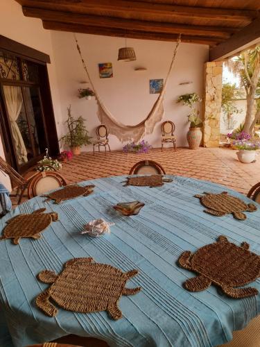 a blue table with turtles on top of it at Villa Dalila in Lampedusa