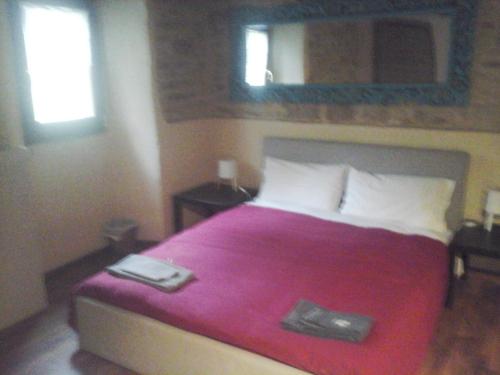 Postel nebo postele na pokoji v ubytování B&B Borgo del Fornello