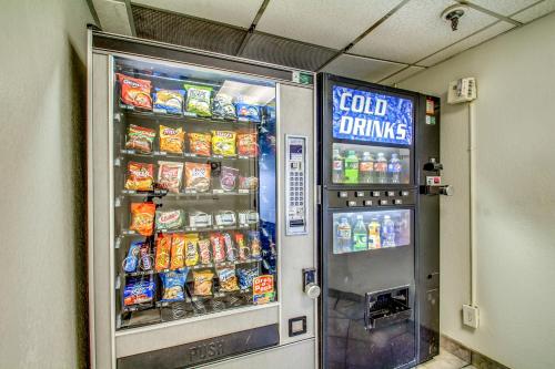 a vending machine with food and drinks in a room at Motel 6-Amherst, NY - Buffalo in Amherst