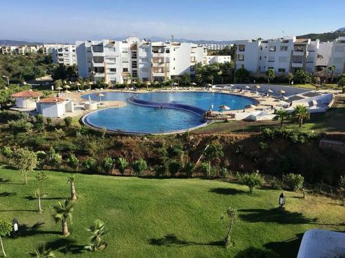 an overhead view of a large swimming pool in a resort at Playa del Pasha in Restinga Smir