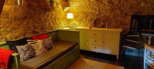 a room with a couch with pillows on it at Casa da Portela in Caminha
