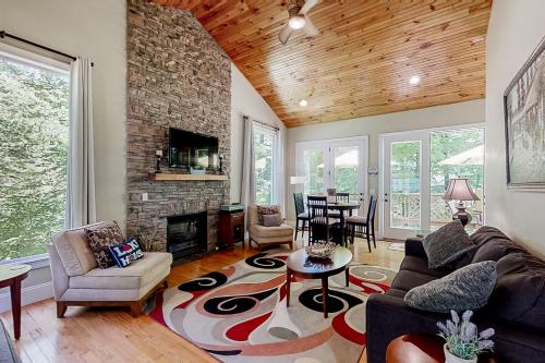 a living room with a couch and a fireplace at The Dawg Pound in Maynardville