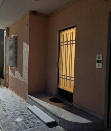 an empty room with a door and a window at Leonidas Private Apartment in Sparta in Sparti