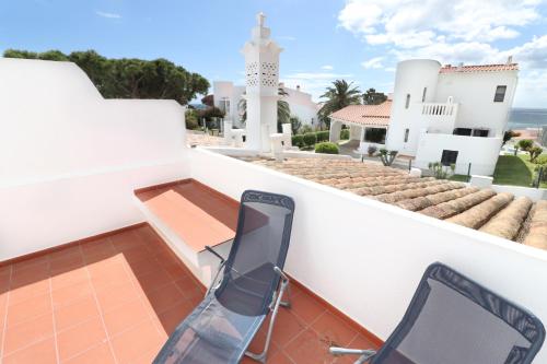 a balcony with a view of a house at Seagull Rooftop Beach @150 m in Vale do Lobo