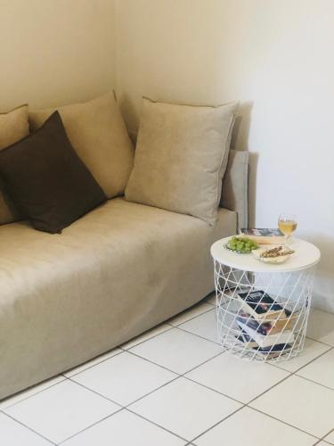 a living room with a couch and a table at Fenareti Apartments in Skala Eresou