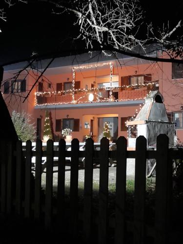 a house with a fence in front of it at Artemis Apartments in Konitsa