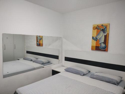 Postel nebo postele na pokoji v ubytování Via Venetto Flat Fortaleza vista mar linda