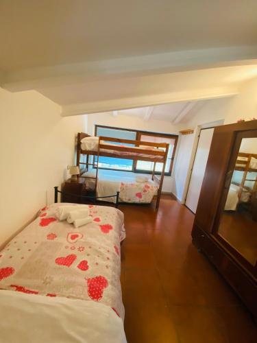 a bedroom with two bunk beds in a room at Casa Barbara in Sant Arcangelo