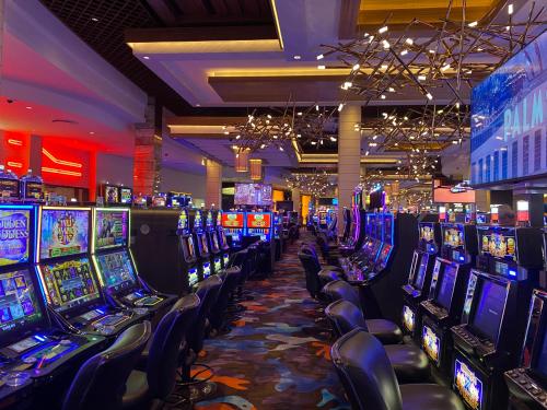 a casino filled with lots of slot machines at Palms Place One Bedroom Suite 1220 sqft in Las Vegas