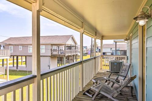 a porch with two chairs and a trash can at Pool Access and Walk to Beach Galveston Home in Galveston