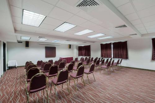 a conference room with chairs and tables in it at Quality Inn Grand Suites Bellingham in Bellingham