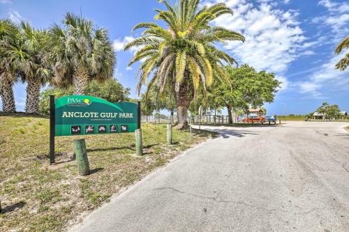a sign on the side of a road with palm trees at Lavish Holiday Home with Lanai and Heated Outdoor Pool in Holiday