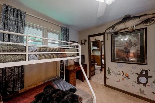 a bedroom with a bunk bed with a fish on the wall at Norris Lake Escape in New Tazewell