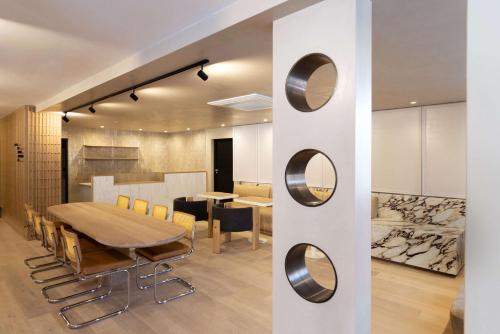 a dining room with a table and chairs at Hyatt House Johannesburg, Sandton in Johannesburg