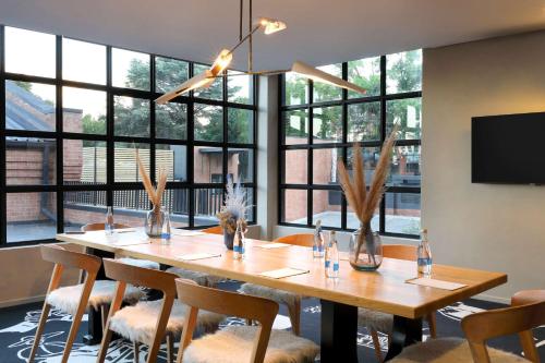 a large dining room with a table and chairs at Hyatt House Johannesburg, Sandton in Johannesburg