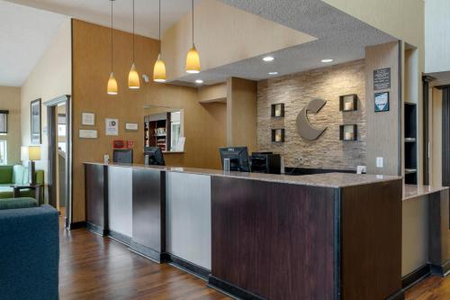 a lobby of a hospital with a reception counter at Comfort Suites DFW Airport in Irving