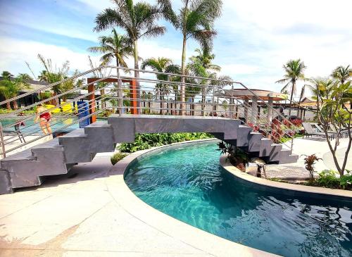 a bridge over a pool at a resort at Salinas Premium Resort in Salinópolis