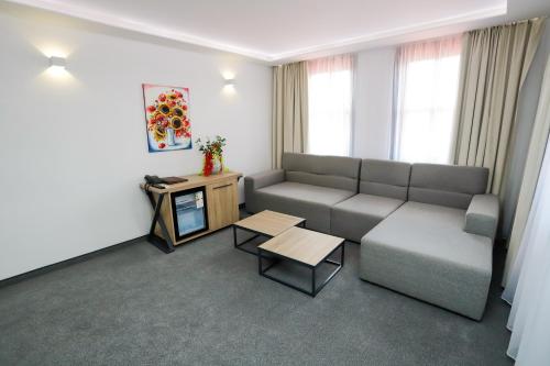a living room with a couch and a table at Glavatarski Han in Glavatartsi