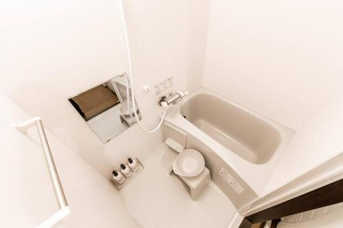 a bathroom with a sink and a toilet at SWEET in Sapporo