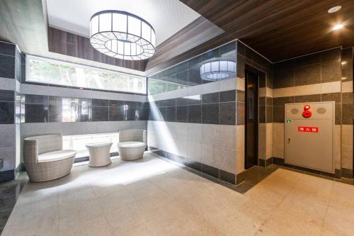 a bathroom with two toilets and two sinks at SPARKLE in Sapporo