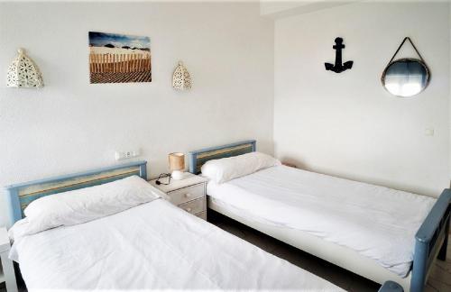 Cama o camas de una habitación en LA NARANJA DENIA 1ªlinea de playa -Wifi- Parking free