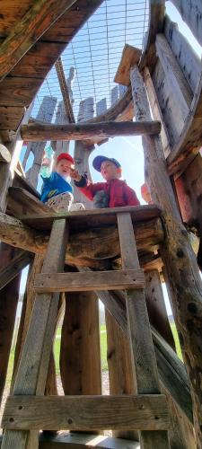 two people in a wooden structure in a building at APARTMENT WALD - im Skigebiet Gerlitzen & Ossiacher See in Bodensdorf