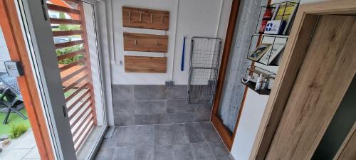 a door leading to a shower in a house at APARTMENT WALD - im Skigebiet Gerlitzen & Ossiacher See in Bodensdorf