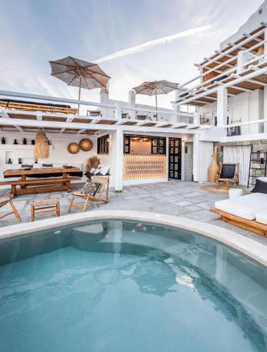a pool in the backyard of a house with a patio at Captain Zeppos in Pollonia
