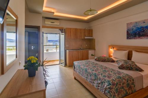 
a bedroom with a bed and a window at Nicole Rooms in Palaiochora
