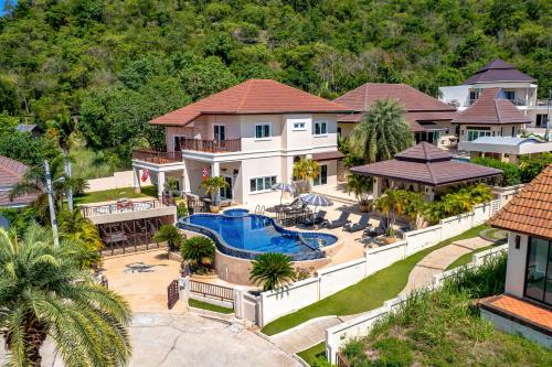 an aerial view of a house with a swimming pool at 5 Bedroom Pool Villa Close To Town H5 in Hua Hin