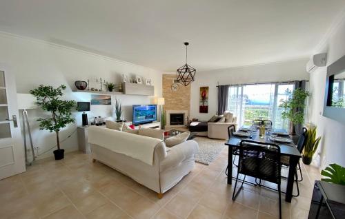 a living room with a couch and a table at Blue Sky apartment Marina in Lagos