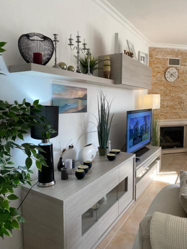 a living room with a tv and a couch at Blue Sky apartment Marina in Lagos