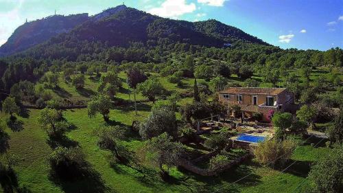an aerial view of a house in a mountain at Finca CanFirella Portocolom in Felanitx