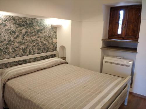 Postel nebo postele na pokoji v ubytování Dammuso U Sarduni