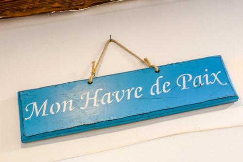 a blue sign that reads mom have de peas at Studio Funtana in Baška