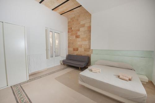 מיטה או מיטות בחדר ב-Lecce Santa Chiara Terrace piano rialzato