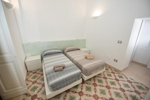 Ένα ή περισσότερα κρεβάτια σε δωμάτιο στο Lecce Santa Chiara Terrace piano rialzato